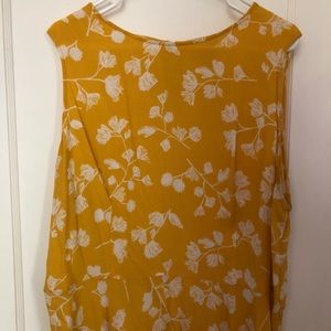 Yellow peplum sleeveless blouse
